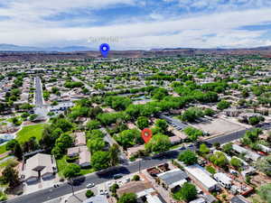 Birds eye view of property with a mountain view and a residential view