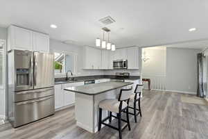 STAINLESS APPLIANCES AND ISLAND