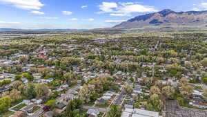 Birds eye view of property with a residential view and a mountain view
