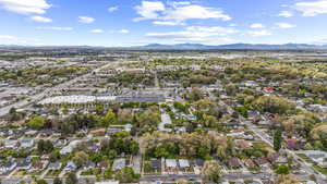 Birds eye view of property featuring a residential view and a mountain view