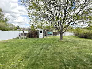 View of yard with a fenced backyard