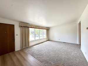 Interior space featuring visible vents and wood finished floors