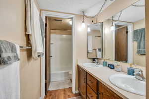 Bathroom features double vanities and separate tub/toilet room