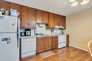 Kitchen with dishwasher, range, refrigerator