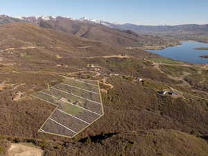 Drone / aerial view with a water and mountain view