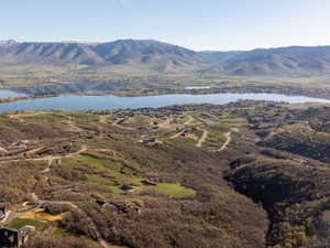Property view of mountains with a water view
