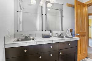 Bathroom 3 featuring double vanity and a sink