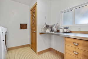 Laundry room with folding station and closet