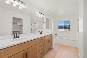 Primary Bath with Huge Vanity. Photo is of a Completed Willow Plan in a Different Location.  Options and Colors will Vary.