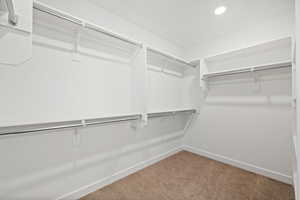 Primary Closet.  Photo is of a Completed Willow Plan in a Different Location.  Options and Colors will Vary.