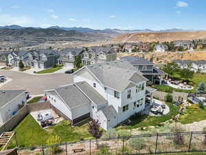 Aerial perspective of suburban area featuring a mountain backdrop