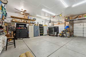 Garage featuring a ceiling fan and a garage door opener