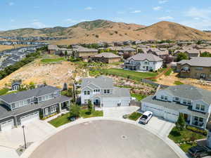 Aerial perspective of suburban area featuring a mountain backdrop