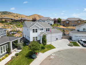 Aerial perspective of suburban area with a mountain backdrop
