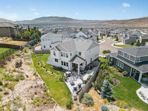 Aerial perspective of suburban area featuring a mountainous background