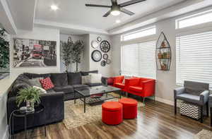 Spacious living room with beautiful mountain views and plenty of natural light coming from the extra large windows and hi window package. Also features wide baseboards, ceiling fan, recessed lighting, and LVP flooring.  ALL WINDOW COVERINGS INCLUDED IN PU