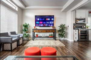 Spacious living room with beautiful mountain views and plenty of natural light coming from the extra large windows and hi window package. Also features wide baseboards, ceiling fan, recessed lighting, and LVP flooring.  ALL WINDOW COVERINGS INCLUDED IN PU