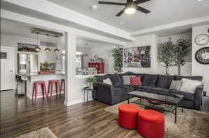Spacious living room and kitchen with beautiful mountain views and plenty of natural light coming from the extra large windows and hi window package. Also features wide baseboards, ceiling fan, recessed lighting, and LVP flooring.  ALL WINDOW COVERINGS IN