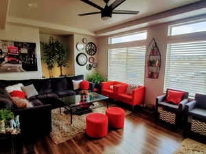 Spacious living room and kitchen with beautiful mountain views and plenty of natural light coming from the extra large windows and hi window package. Also features wide baseboards, ceiling fan, recessed lighting, and LVP flooring.  ALL WINDOW COVERINGS IN