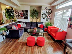 Spacious living room and kitchen with beautiful mountain views and plenty of natural light coming from the extra large windows and hi window package. Also features wide baseboards, ceiling fan, recessed lighting, and LVP flooring.  ALL WINDOW COVERINGS IN