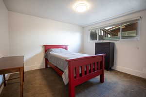 Carpeted bedroom featuring baseboards
