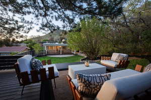 View of patio / terrace with a deck with mountain view, outdoor lounge area, and outdoor dining space