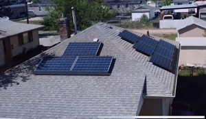 Exterior details of shingled roof with solar panels