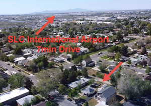Drone / aerial view featuring a residential view and 7 minute drive-time to Salt Lake City International Airport