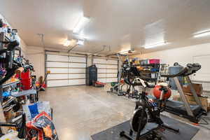 Garage featuring a garage door opener