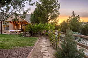 Yard at dusk with fence