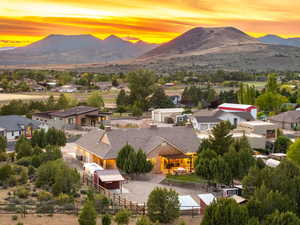 Aerial view at dusk with a residential view and a mountain view
