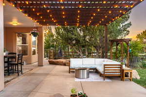View of patio / terrace featuring a fenced backyard, outdoor lounge area, and a pergola