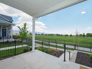 View of patio / terrace featuring fence and a rural view