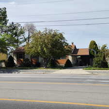 Obstructed view of property featuring concrete driveway