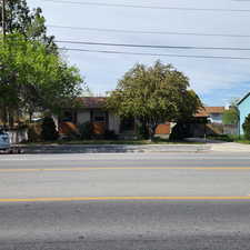 View of front of property featuring fence
