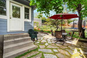View of patio / terrace featuring fence, outdoor dining space.
