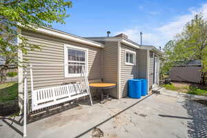 Back of house with a patio