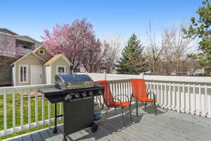 Deck with fence and a grill