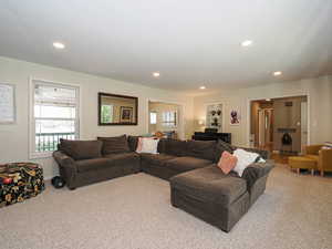Living area featuring carpet and recessed lighting