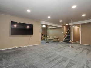 Finished basement with stairway, baseboards, carpet, and recessed lighting
