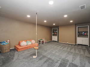 Recreation room with carpet floors, recessed lighting, baseboards, and visible vents