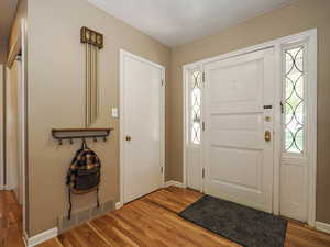 Entrance foyer featuring baseboards, visible vents, and light wood-type flooring