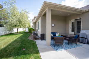 View of patio featuring an outdoor living space, central AC, fence, and area for grilling