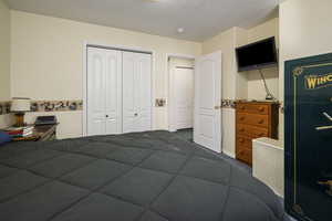 Bedroom with a closet and carpet flooring