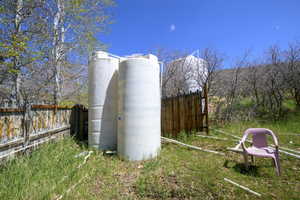 View of outdoor structure featuring fence