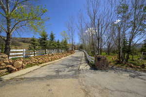 View of street featuring aphalt driveway