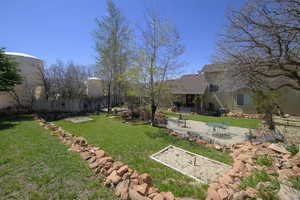 View of yard featuring a patio area and fence