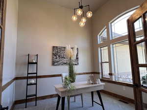 Home office featuring carpet floors, baseboards, and visible vents