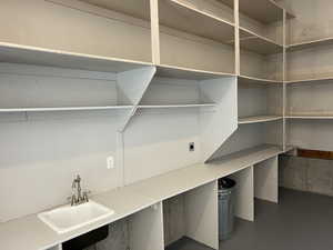 Pantry featuring a sink