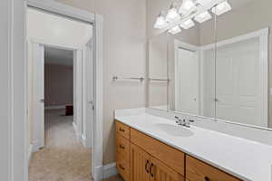 Bathroom featuring baseboards and vanity